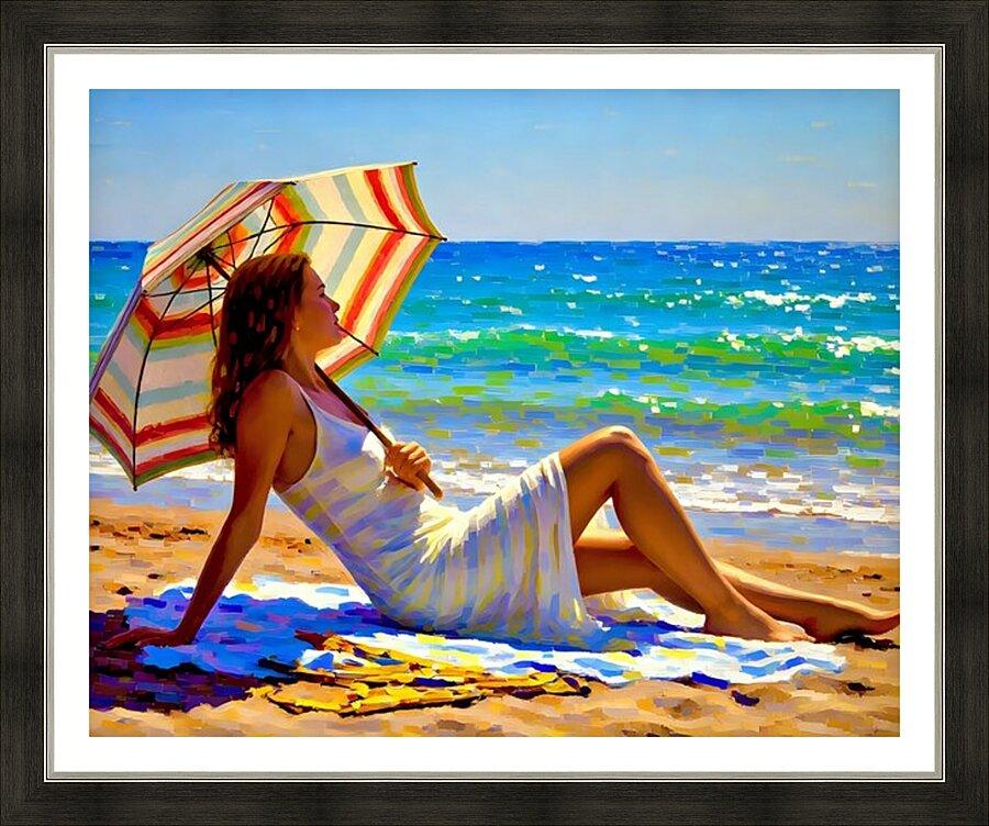 Framed beach art print showing a woman in a white dress seated on sand with a striped umbrella
