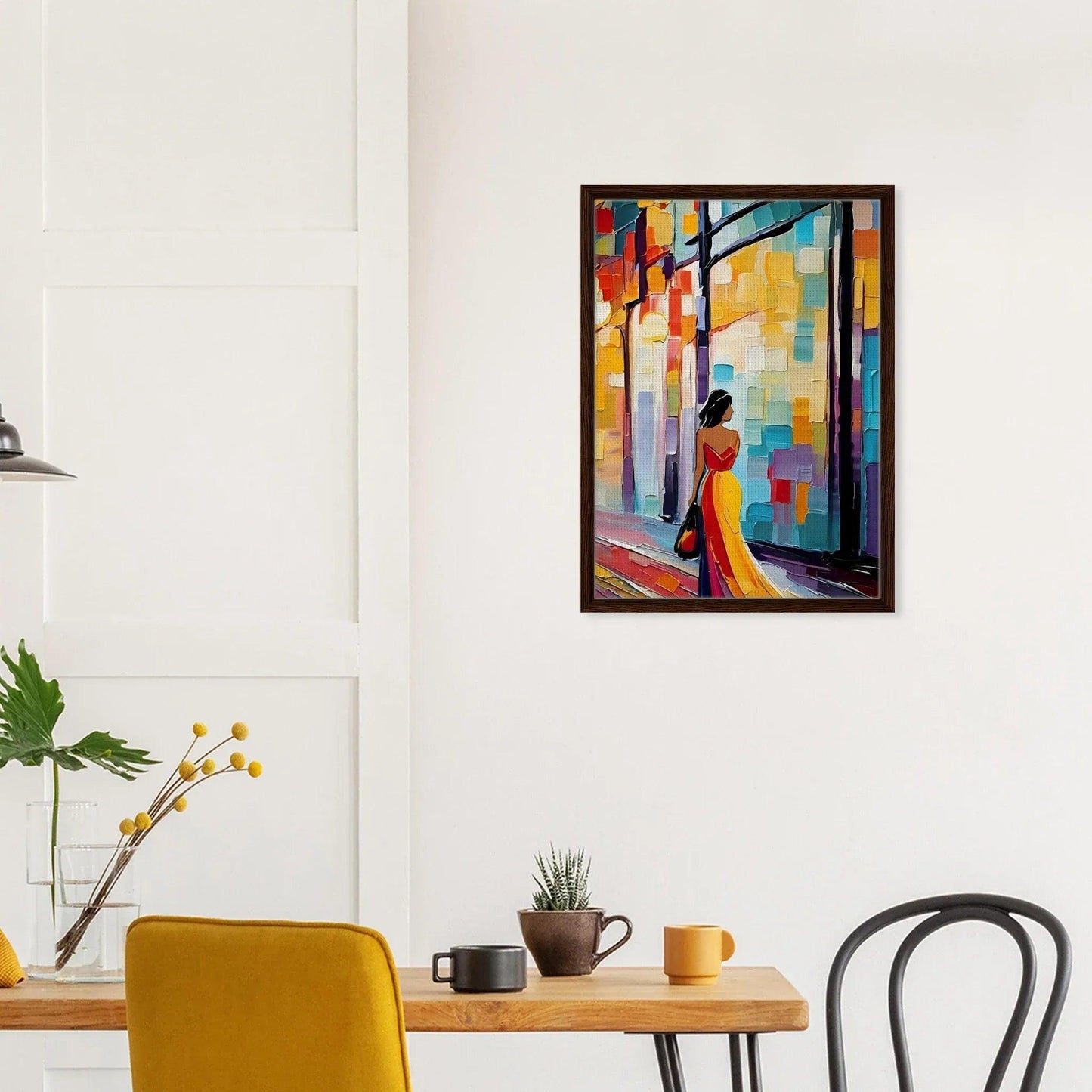 Framed canvas wall art with a colorful urban figurative scene and a dark wood frame