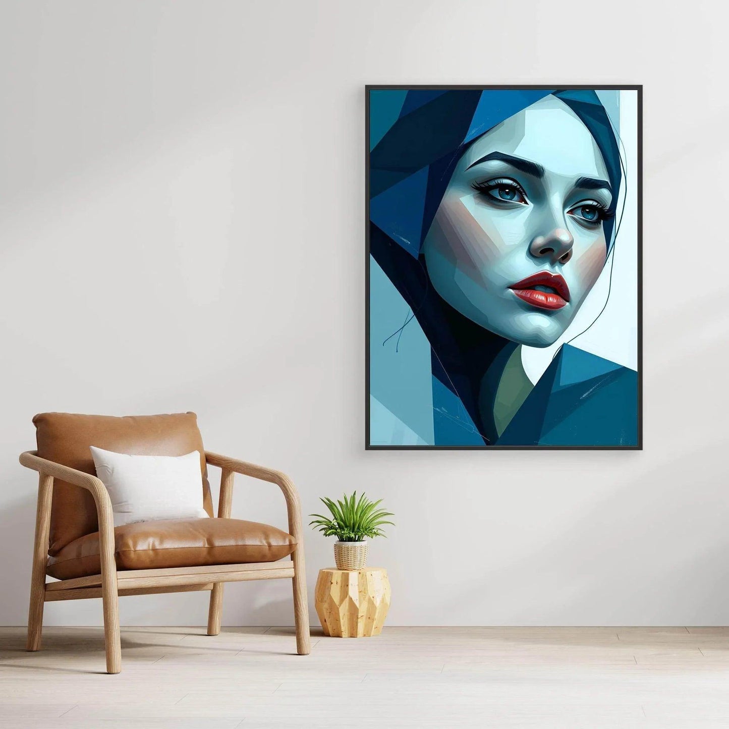 Framed blue geometric portrait artwork with woman's face in blue tones and red lips