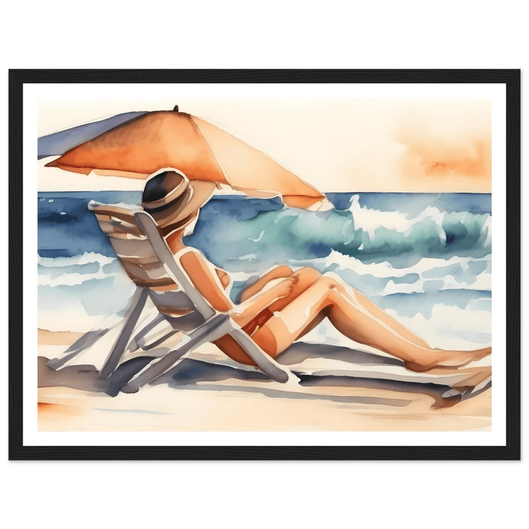 Beach lounging watercolor print in black frame, person reclines on chair by ocean waves.
