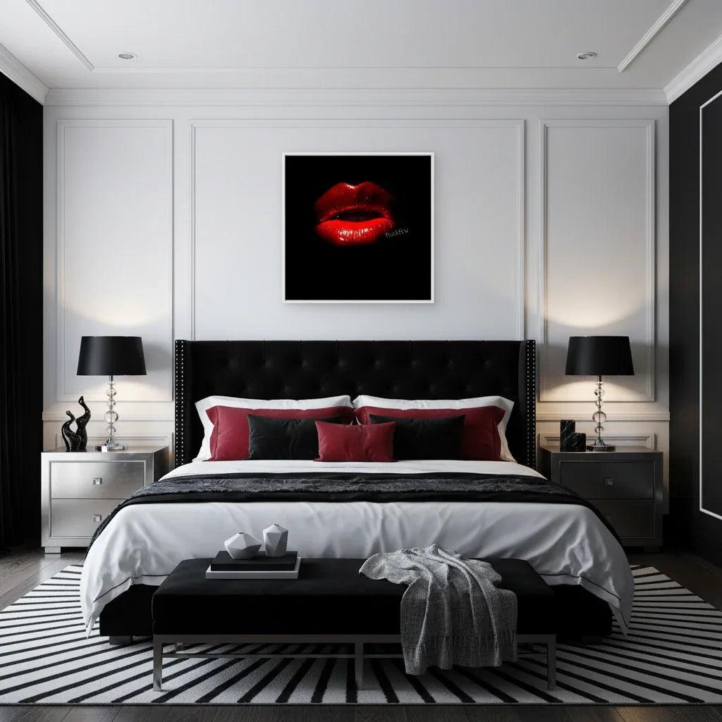 Framed wall art of glossy red lips on black background, white frame