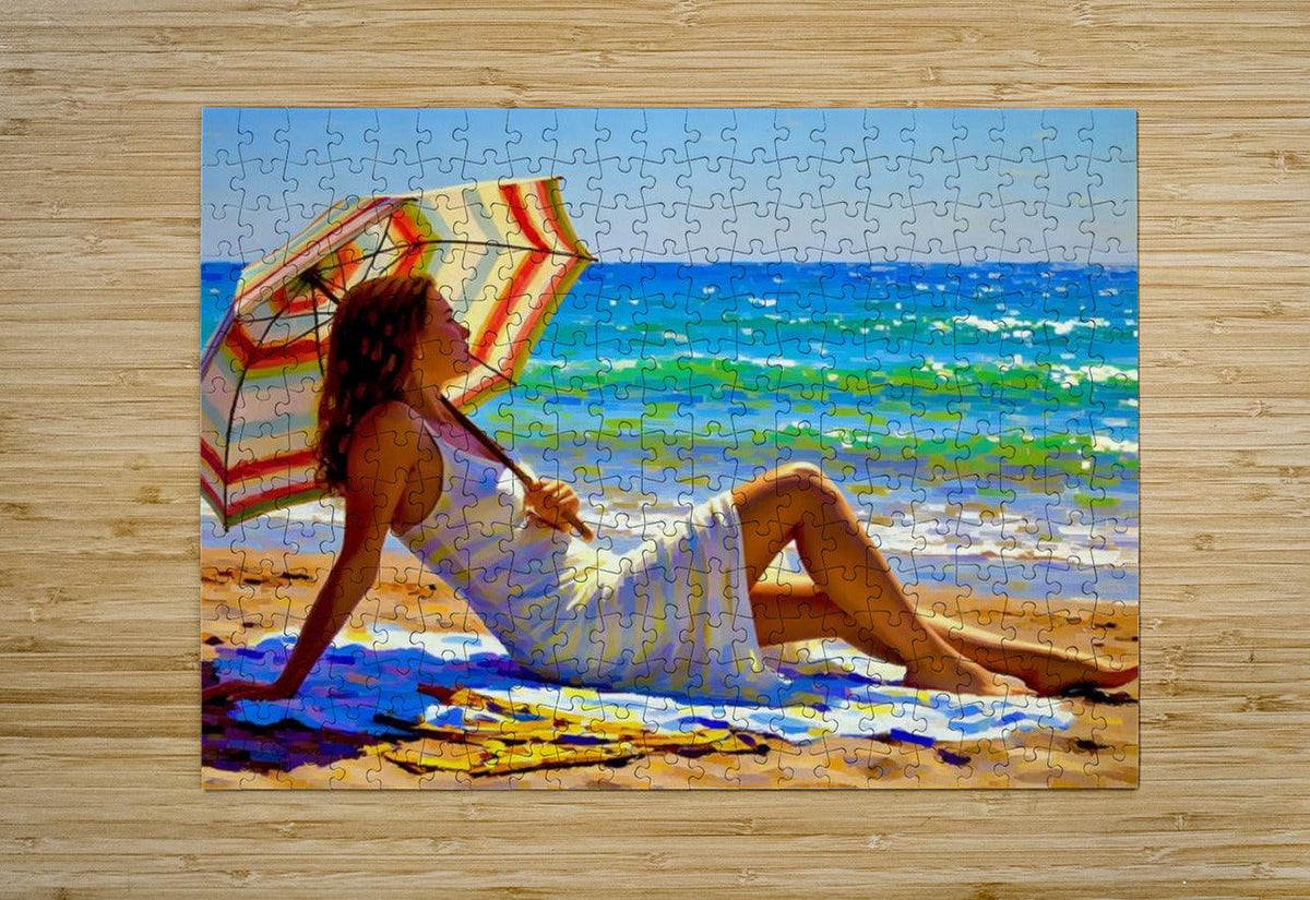 Beach jigsaw puzzle print featuring a reclining woman with striped umbrella