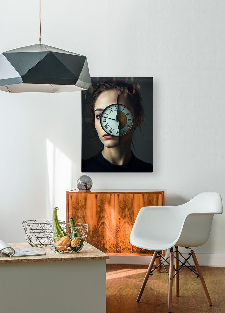 Framed surreal portrait wall art: woman with clock over face, dark top.