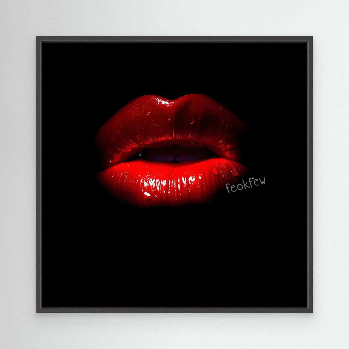 Framed wall art featuring glossy red lips on black background, dark gray frame