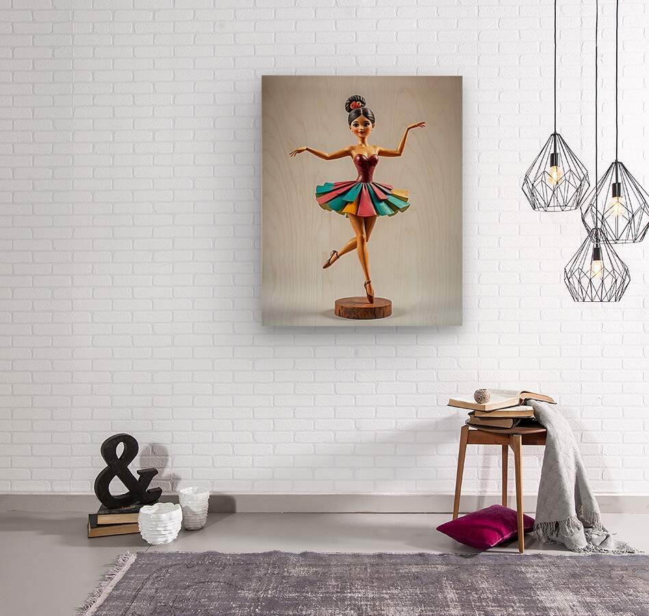 Framed ballerina print on wall: maroon leotard with multicolor tutu, on wood base.