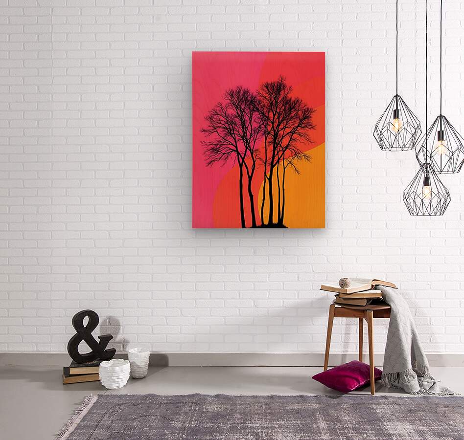 Canvas wall art with black tree silhouettes and pink-orange sunset scene on a white wall.